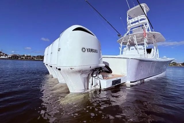 Slide: The Image of 2017 Regulator 41 boat with Yamaha outboard engines on calm water. - 10