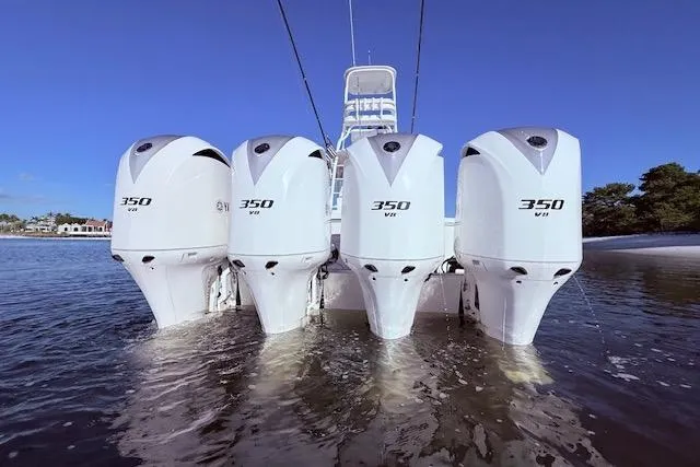 Slide: The Image of Four Yamaha 350 V8 outboard engines on a 2017 Regulator 41 boat in water. - 11