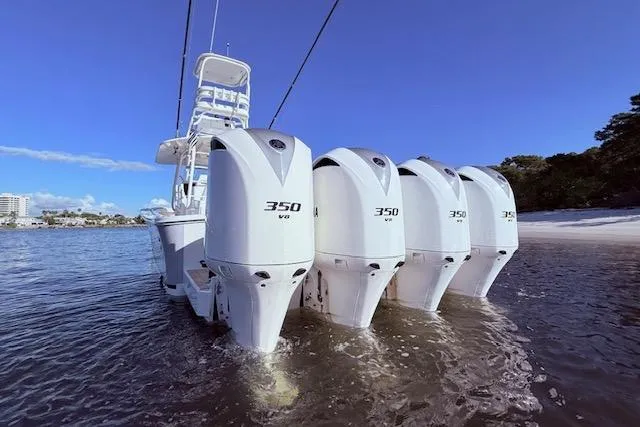 Slide: The Image of 2017 Regulator 41 boat with four 350 V8 engines in shallow water. - 12