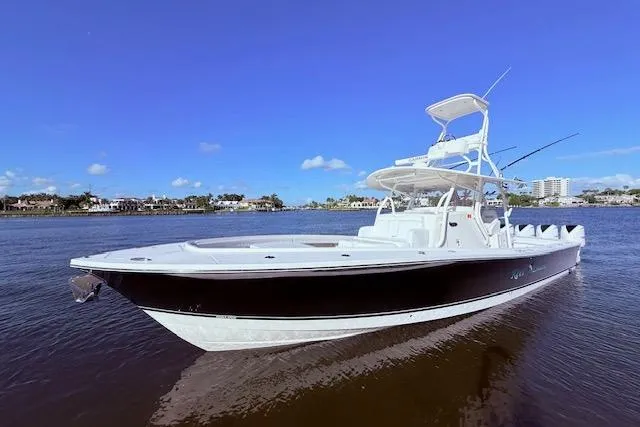Slide: The Image of 2017 Regulator 41 boat on calm water under clear blue sky. - 14