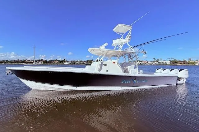 Slide: The Image of 2017 Regulator 41 boat on water, clear sky, side view. - 16