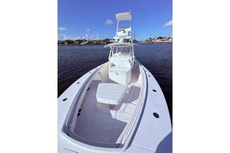 Slide: The Image of 2017 Regulator 41 boat on water, clear sky, spacious deck, luxury design. - 21