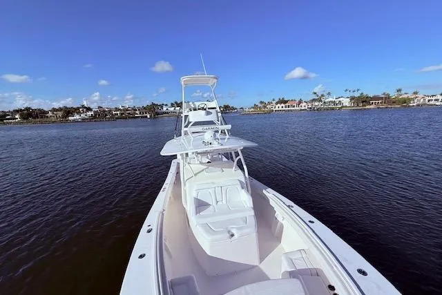 Slide: The Image of 2017 Regulator 41 boat on calm water with clear blue sky. - 22