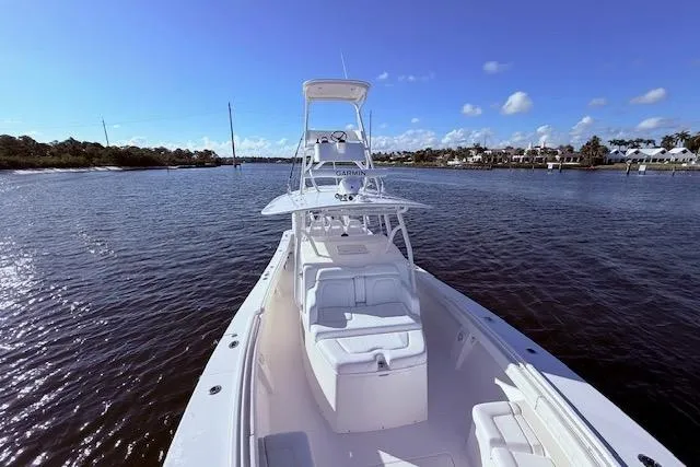 Slide: The Image of 2017 Regulator 41 boat on calm water under clear blue sky. - 29