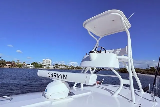 Slide: The Image of 2017 Regulator 41 boat with Garmin radar, blue sky, and waterfront view. - 39