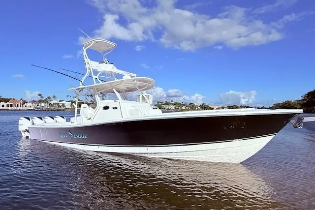 Slide: The Image of 2017 Regulator 41 boat on calm water under a clear blue sky. - 4