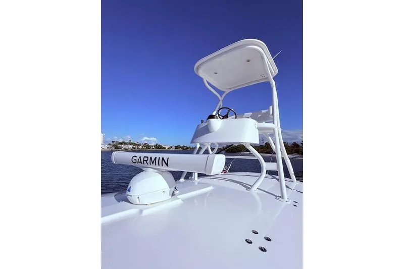 Slide: The Image of 2017 Regulator 41 boat with Garmin radar, clear blue sky background. - 40