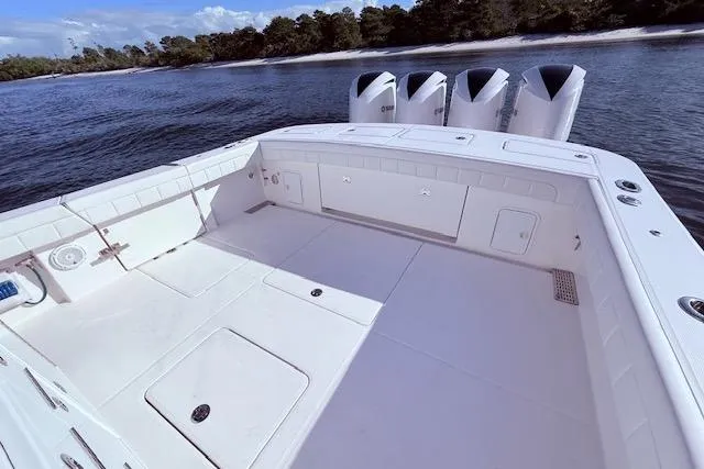 Slide: The Image of 2017 Regulator 41 boat deck with quad engines, near shoreline. - 46