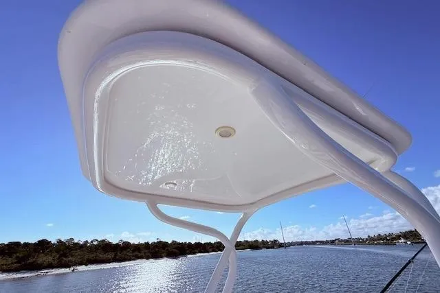 Slide: The Image of 2017 Regulator 41 boat canopy against a clear blue sky and water backdrop. - 62