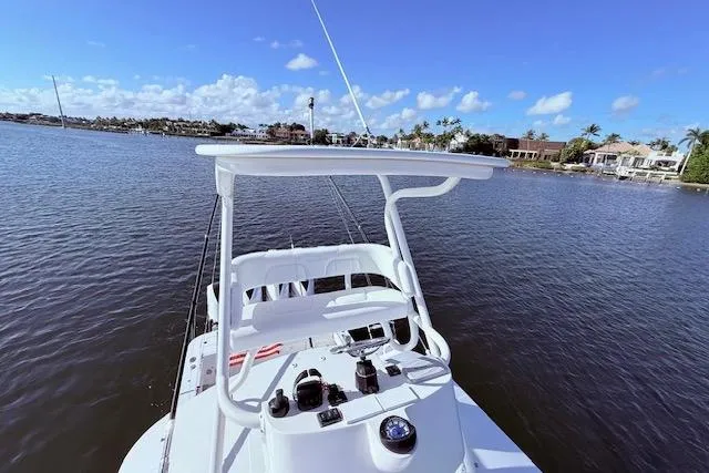Slide: The Image of 2017 Regulator 41 boat on calm water with clear blue sky. - 69