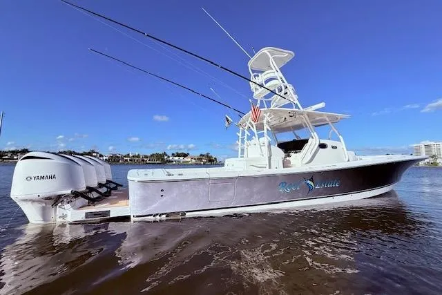 Slide: The Image of 2017 Regulator 41 boat with Yamaha engines on calm water under clear blue sky. - 7