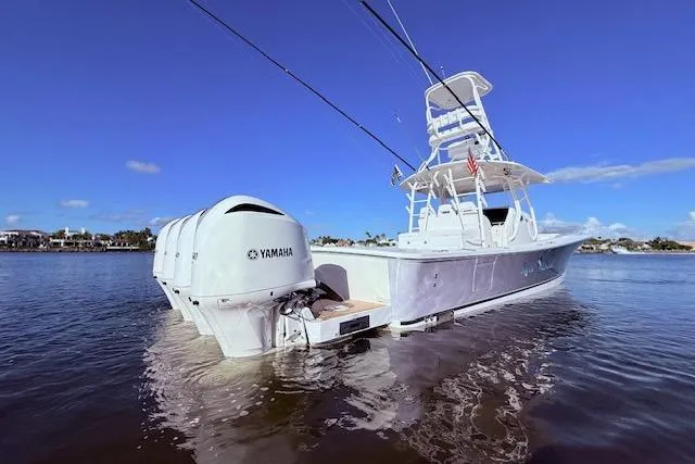 Slide: The Image of 2017 Regulator 41 boat with Yamaha engines on calm water under clear blue sky. - 8