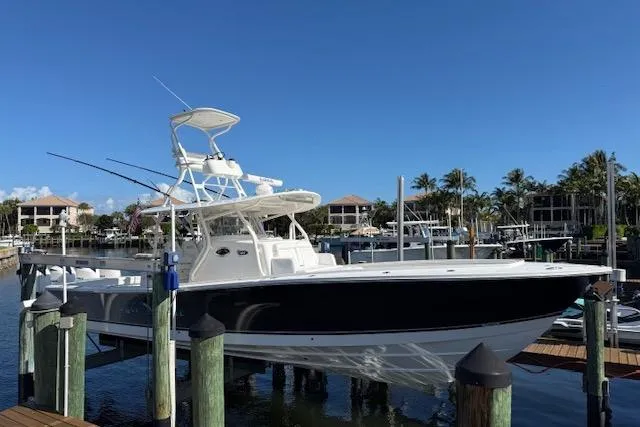 Slide: The Image of 2017 Regulator 41 boat docked in a marina under clear blue skies. - 81