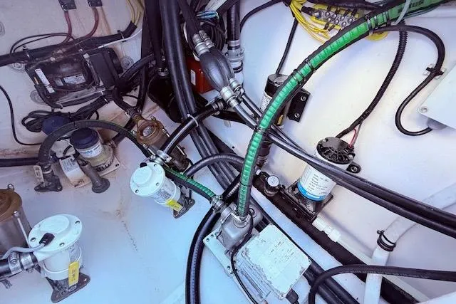 Slide: The Image of Engine compartment of a 2017 Regulator 41 boat, showcasing wiring and mechanical components. - 82