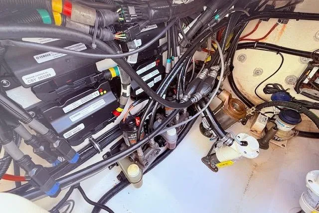Slide: The Image of Engine compartment of a 2017 Regulator 41 boat, showcasing wiring and mechanical components. - 83