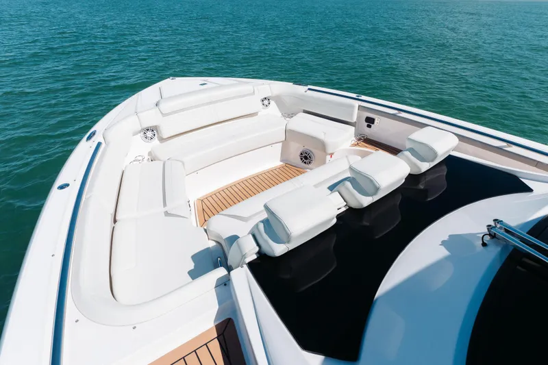 Slide: The Image of Luxurious 2023 Tiara 48 yacht with spacious seating on open water. - 19