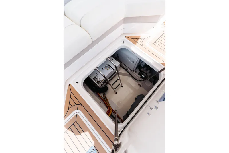Slide: The Image of Engine compartment of 2023 Tiara 48 yacht, showcasing interior details and ladder access. - 26