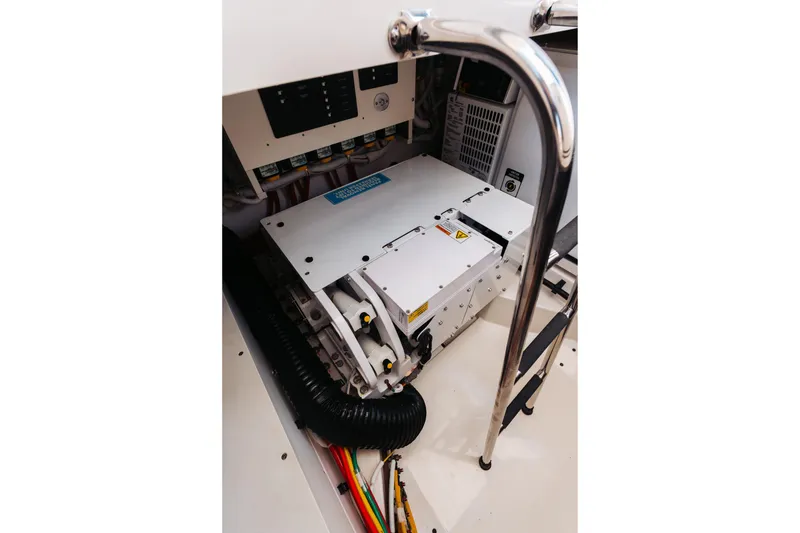 Slide: The Image of Engine room of 2023 Tiara 48 yacht with electrical components and wiring. - 27