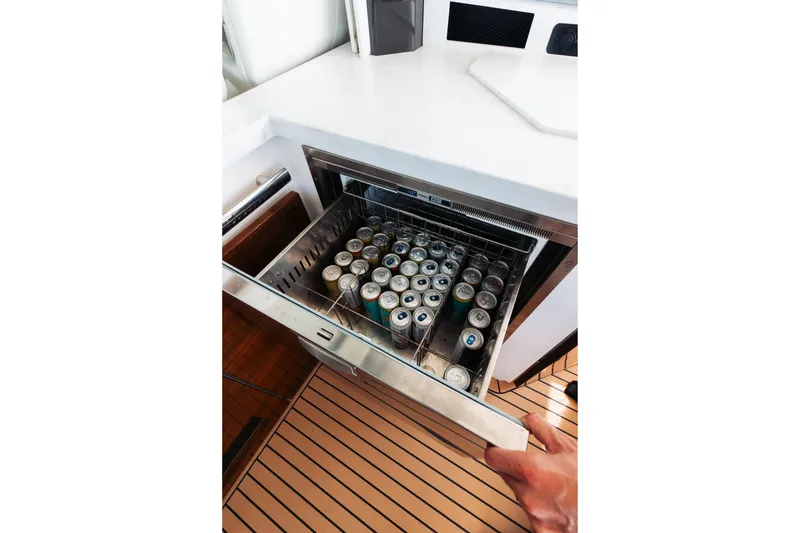 Slide: The Image of Open drawer fridge with canned drinks on Tiara 48 yacht, 2023 model. - 32