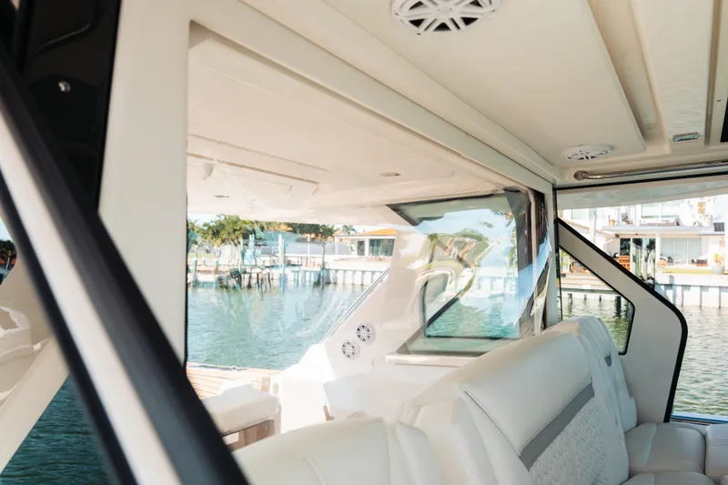 Slide: The Image of Luxurious interior of 2023 Tiara 48 yacht with waterfront view. - 34