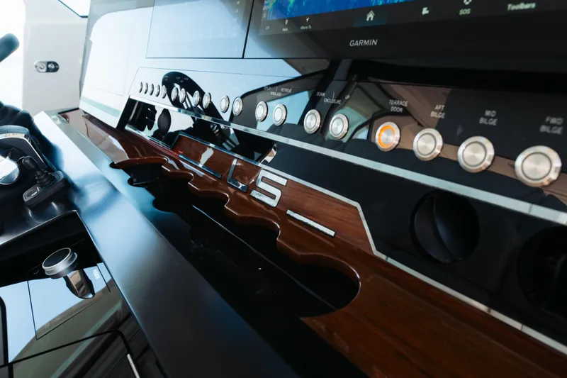 Slide: The Image of Control panel of 2023 Tiara 48 yacht with modern navigation and control systems. - 57