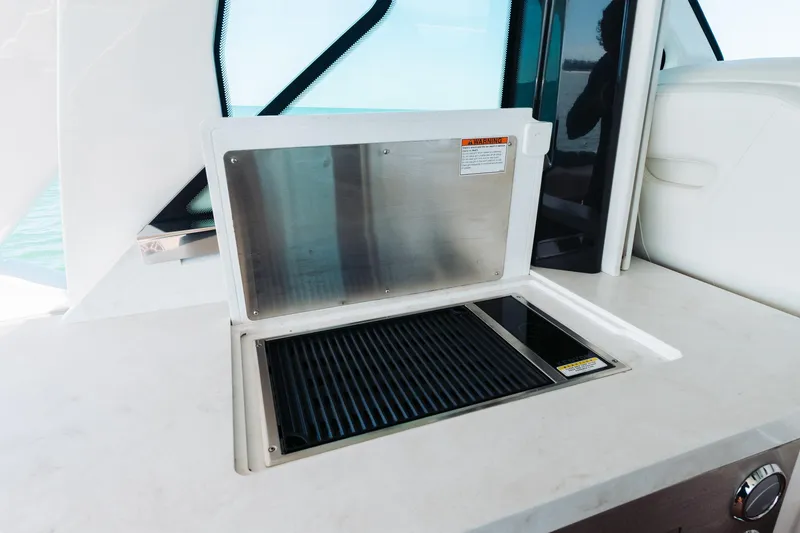 Slide: The Image of Outdoor grill on 2023 Tiara 48 yacht, featuring sleek design and modern amenities. - 58