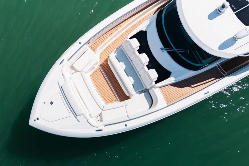 Slide: The Image of Aerial view of 2023 Tiara 48 yacht with sleek design and spacious deck. - 7