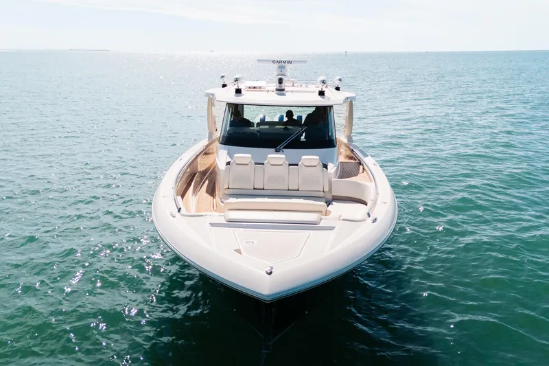 Slide: The Image of 2023 Tiara 48 yacht on open water, front view, sunny day. - 8