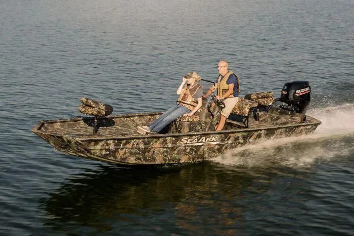 Slide: The Image of 2022 SeaArk 180 RXT boat with camouflage design on a trailer. - 28