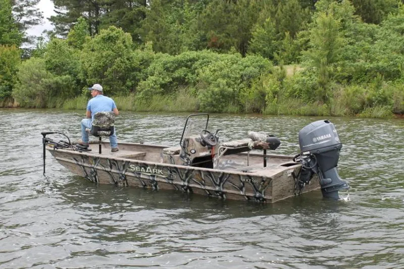 Slide: The Image of 2022 SeaArk 180 RXT boat with camouflage pattern and visible serial number plate. - 29