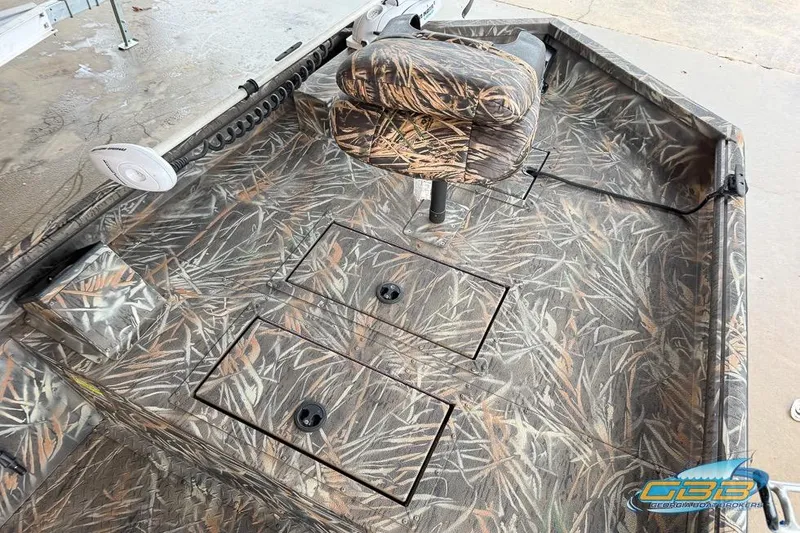 Slide: The Image of 2022 SeaArk 180 RXT boat with camouflage design and fishing rod holders. - 3