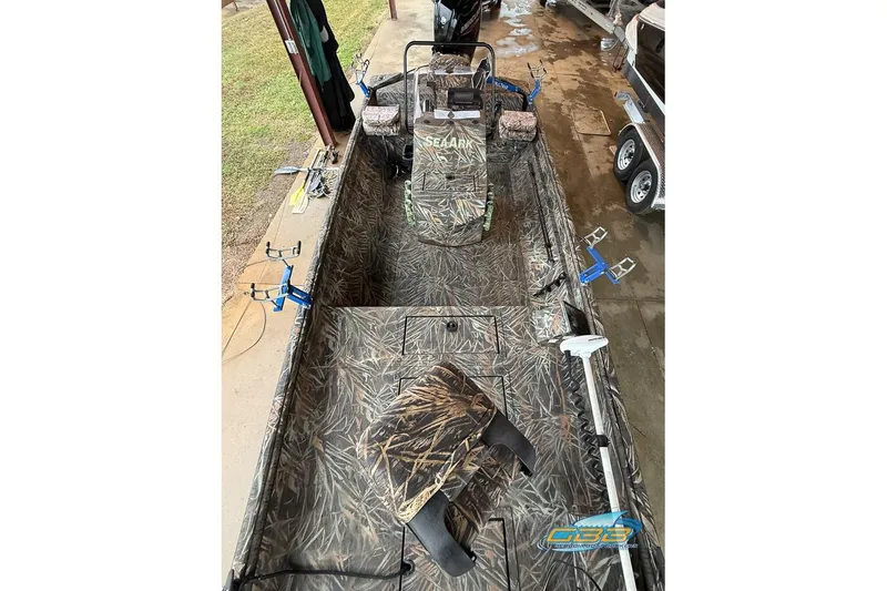 Slide: The Image of 2022 SeaArk 180 RXT boat dashboard with steering wheel and control panel. - 8