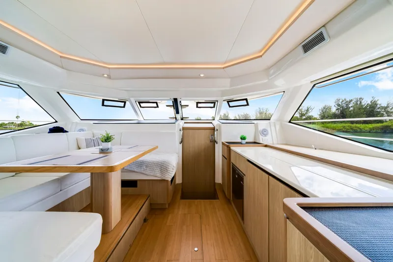 Slide: The Image of Luxurious interior of 2019 Aquila 44 Yacht with modern furnishings and panoramic windows. - 11