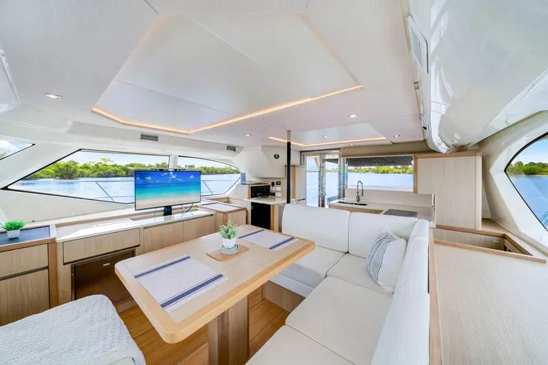 Slide: The Image of Luxurious interior of 2019 Aquila 44 Yacht with modern furnishings and scenic water view. - 13