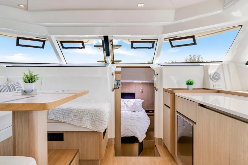Slide: The Image of Luxurious interior of 2019 Aquila 44 Yacht with modern furnishings and natural light. - 14