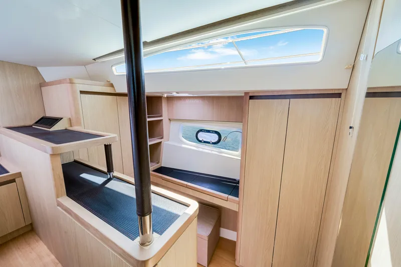 Slide: The Image of Luxurious interior of 2019 Aquila 44 Yacht with modern wood finish and ample natural light. - 17