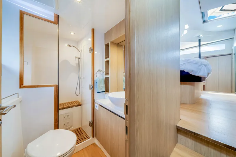 Slide: The Image of Luxurious bathroom and bedroom interior of 2019 Aquila 44 Yacht, featuring modern design. - 19