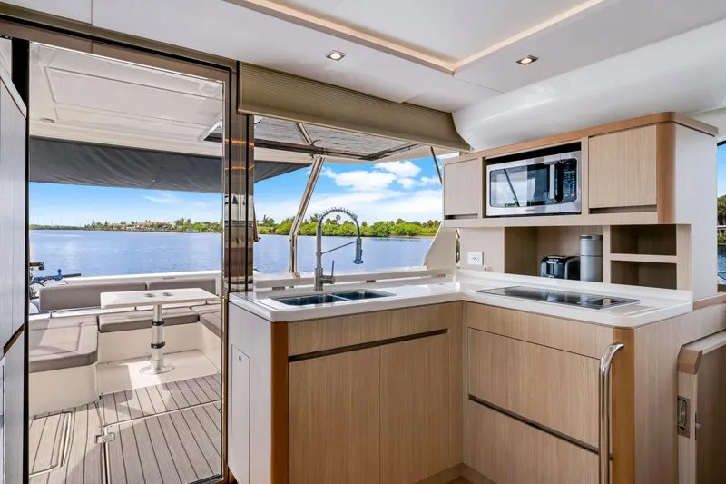 Slide: The Image of Modern kitchen interior of 2019 Aquila 44 Yacht with scenic water view. - 2