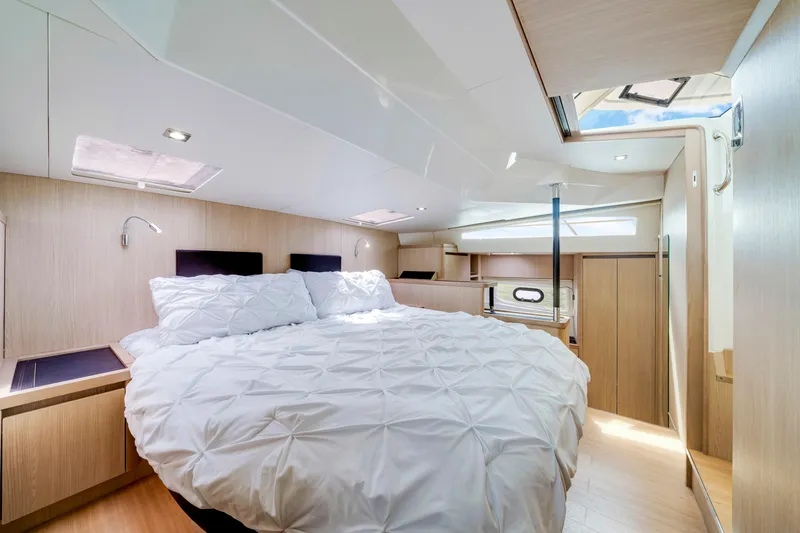 Slide: The Image of Luxurious bedroom interior of 2019 Aquila 44 Yacht with modern design and skylight. - 21