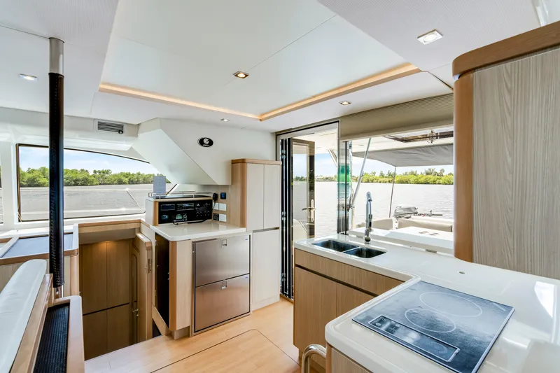 Slide: The Image of Interior of 2019 Aquila 44 Yacht featuring modern kitchen and scenic water view. - 30