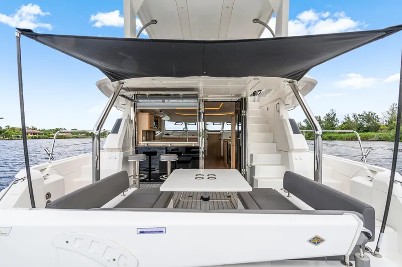 Slide: The Image of 2019 Aquila 44 Yacht with shaded outdoor seating and interior view. - 37