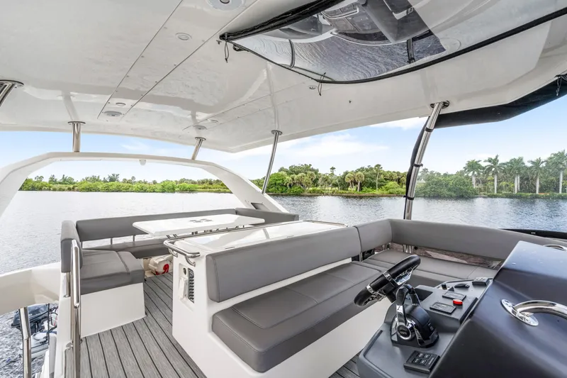 Slide: The Image of Luxurious 2019 Aquila 44 Yacht interior with sleek seating and scenic water view. - 47