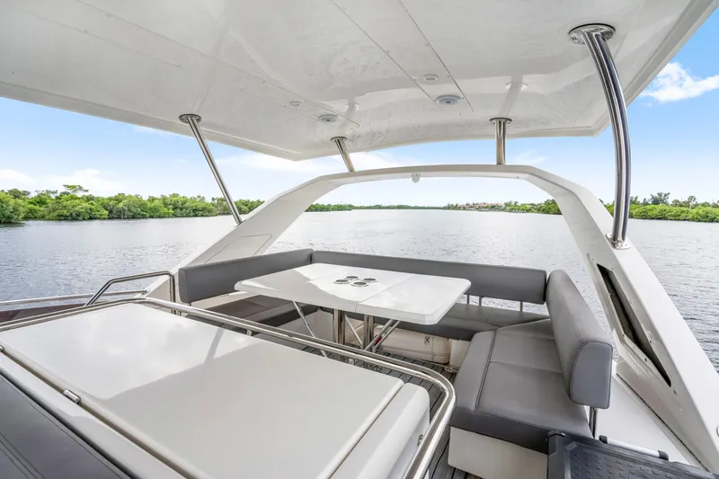 Slide: The Image of Luxurious 2019 Aquila 44 Yacht with spacious outdoor seating and scenic water view. - 48
