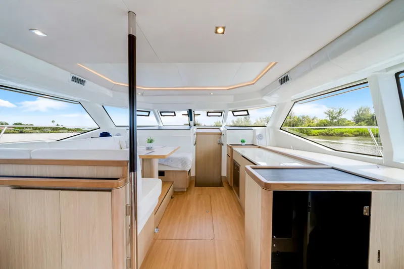 Slide: The Image of Interior of 2019 Aquila 44 Yacht, featuring modern design and panoramic windows. - 5