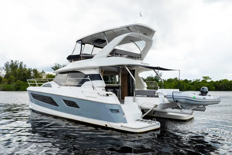 Slide: The Image of 2019 Aquila 44 Yacht on calm water, featuring sleek design and modern amenities. - 61