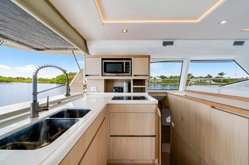 Slide: The Image of Modern kitchen interior of 2019 Aquila 44 Yacht with sleek design and scenic water view. - 9
