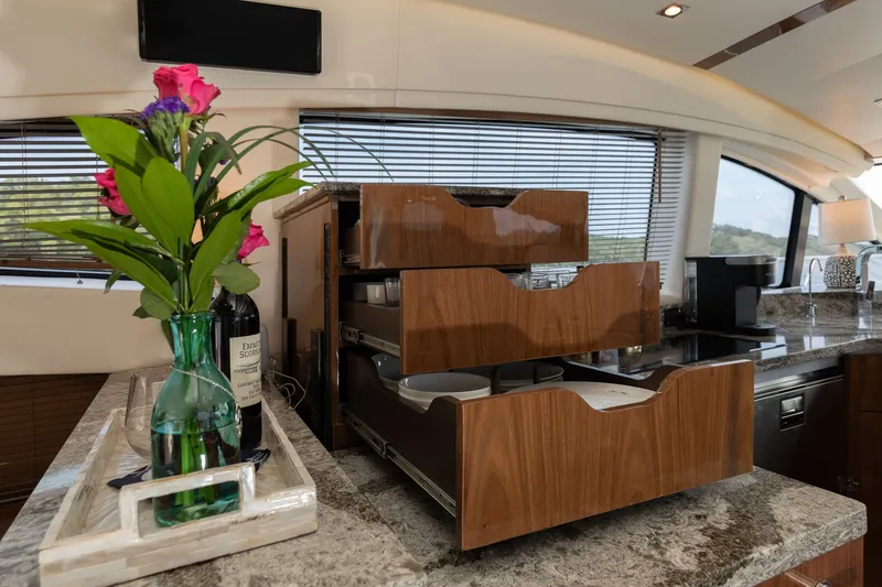 Slide: The Image of Interior of 2018 Sea Ray L650 Fly with elegant kitchen. - 24