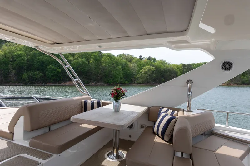 Slide: The Image of Luxurious seating area on a 2018 Sea Ray L650 Fly yacht. - 34
