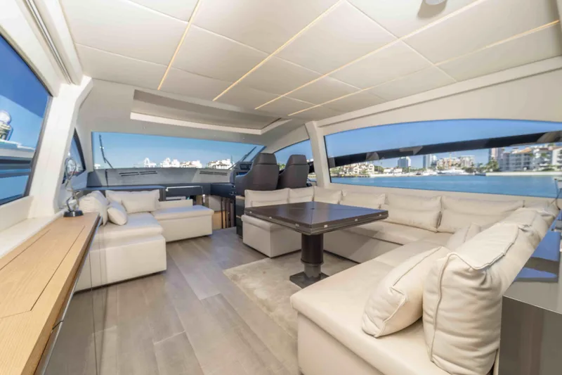 Slide: The Image of Luxurious interior of 2018 Pershing 70 yacht with elegant seating and panoramic windows. - 11
