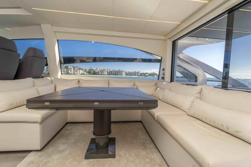 Slide: The Image of Luxurious interior of 2018 Pershing 70 yacht with elegant seating and scenic ocean view. - 12